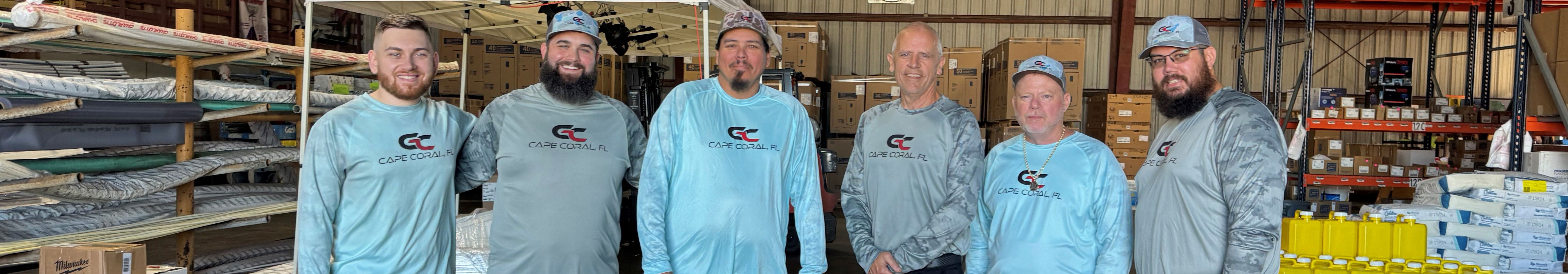 Gorman Cape Coral Wholesale Plumbing, Pool, Well & Septic team standing together in warehouse